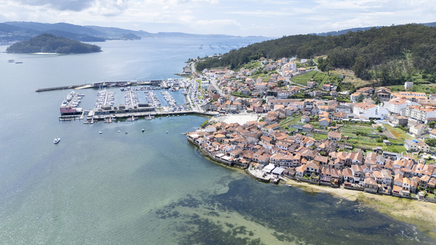 Aerial view of the historic coastal village of Combarro with its traditional stone houses and marina along the Ria de Pontevedra Combarro Pontevedra Spain. Aerial view of the historic coastal village of Combarro with its traditional stone houses and marina along the Ria de Pontevedra Combarro Pontevedra Spain.