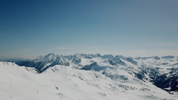 Aerial view of snowy Pyrenees peaks in Baqueira Spain.