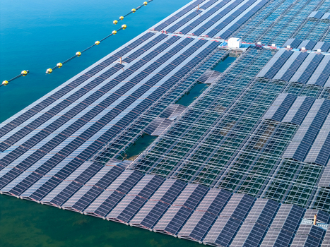 Aerial view of the floating solar farm at Cottbuser Ostsee showing rows of solar panels on the water surface with some sections damaged by storm located in Cottbus Brandenburg Germany. Aerial view of the floating solar farm at Cottbuser Ostsee showing rows of solar panels on the water surface with some sections damaged by storm located in Cottbus Brandenburg Germany.