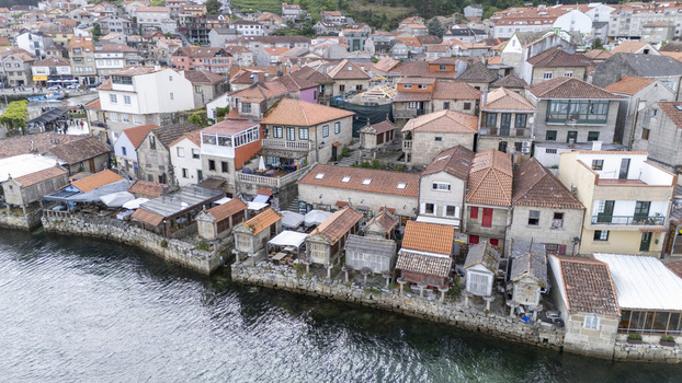 Combarro Spain 02 May 2026 Aerial view of Horreos de Combarro and traditional stone houses with red tiled roofs along the waterfront.