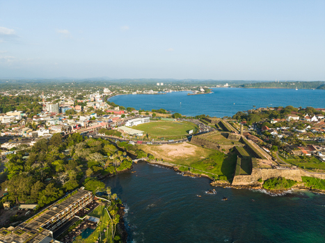 Aerial view of Galle Fort and the cricket stadium along the coastline under a clear blue sky Galle Southern Province Sri Lanka.