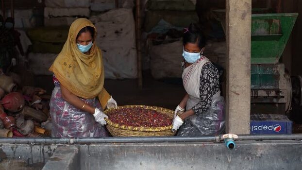 View of women working in a factory in Bogura Bangladesh. View of women working in a factory in Bogura Bangladesh.