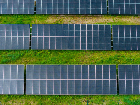 Aerial view of solar panels arranged in neat rows across a green field in Olaine Olaine Municipality Latvia. Aerial view of solar panels arranged in neat rows across a green field in Olaine Olaine Municipality Latvia.