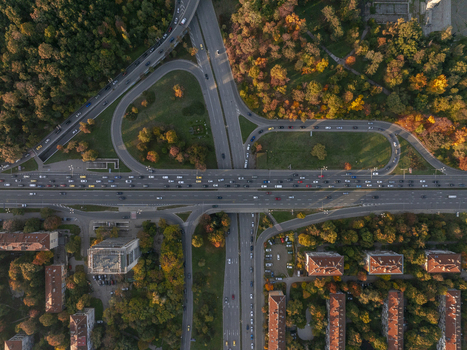 Aerial view of a busy highway interchange surrounded by autumn trees and residential buildings in Sofia Sofia City Province Bulgaria.