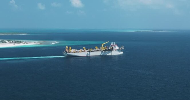 Aerial view of an industrial ship near the coast Maldives. Aerial view of an industrial ship near the coast Maldives.