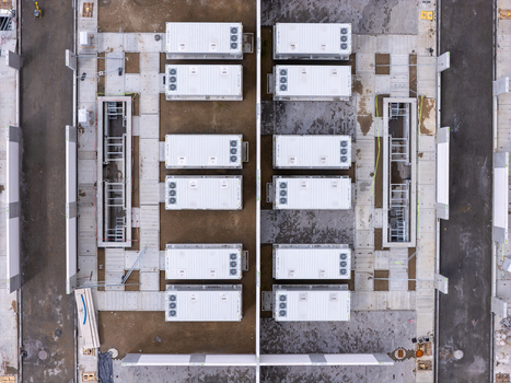 Aerial view of the Zarnowiec Pumped Storage Power Plant featuring rows of white battery energy storage containers arranged on a concrete site in Wejherowo County Pomeranian Voivodeship Poland.