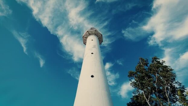 View of Saxby Lighthouse under a blue sky in Estonia.