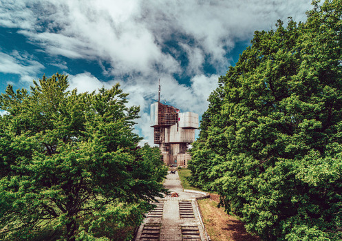 Aerial view of the Monument to the Uprising of the People of Kordun and Banija surrounded by lush green trees in Crevarska Strana Sisak Moslavina County Croatia.