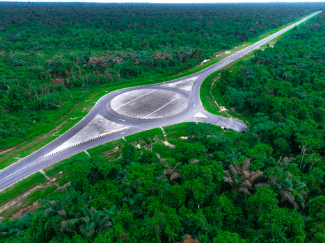 Aerial view of the roundabout on Bonny Island surrounded by dense tropical forest in Bonny Town Rivers Nigeria. Aerial view of the roundabout on Bonny Island surrounded by dense tropical forest in Bonny Town Rivers Nigeria.