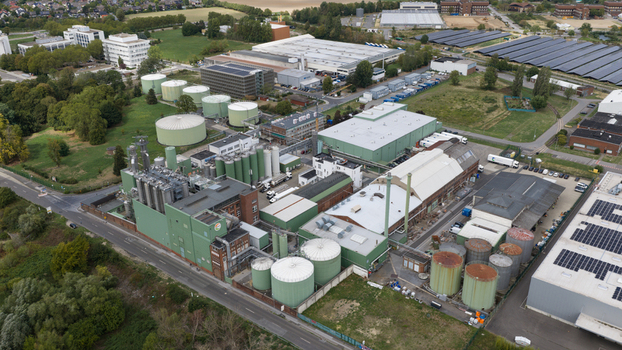 Monheim am Rhein Germany 04 September 2026 Aerial view of the UNIFERM GmbH Co. KG industrial facility featuring large storage tanks production buildings and surrounding green spaces.