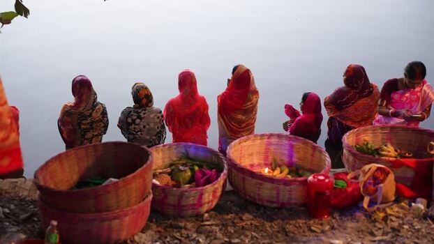 View of women performing a ritual with baskets of offerings Bangladesh. View of women performing a ritual with baskets of offerings Bangladesh.