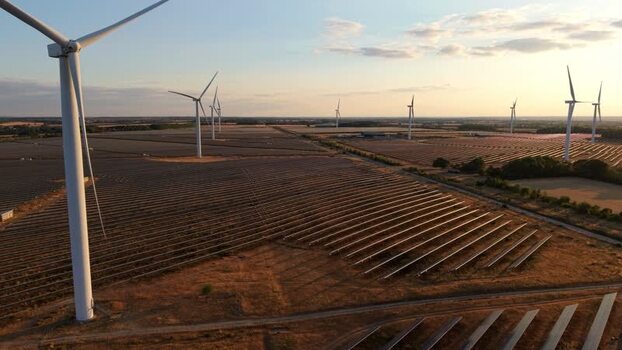 Aerial view of Chelveston solar and wind farm at sunset United Kingdom. Aerial view of Chelveston solar and wind farm at sunset United Kingdom.