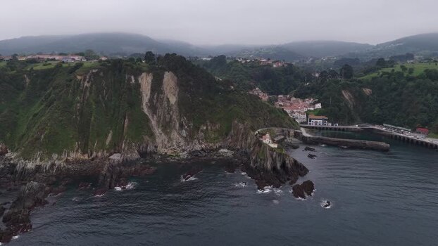 Aerial view of the coastal village of Cudillero and steep cliffs Spain. Aerial view of the coastal village of Cudillero and steep cliffs Spain.