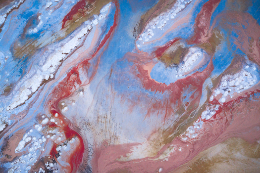 Aerial view of swirling pastel hues intermingle with metallic gold creating an ethereal landscape of dreams and wonder Salt lake city Utah United States. Aerial view of swirling pastel hues intermingle with metallic gold creating an ethereal landscape of dreams and wonder Salt lake city Utah United States.