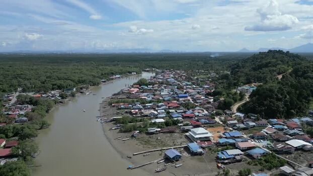 Aerial view of a riverside village in Sarawak Malaysia. Aerial view of a riverside village in Sarawak Malaysia.