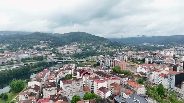 Aerial view of the Millennium Bridge and city skyline in Ourense Spain. Aerial view of the Millennium Bridge and city skyline in Ourense Spain.