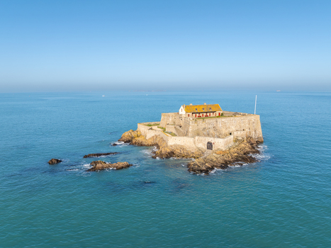 Aerial view of Fort National stands defiant against the turquoise sea a stone sentinel under a clear sky Saint Malo Brittany France. Aerial view of Fort National stands defiant against the turquoise sea a stone sentinel under a clear sky Saint Malo Brittany France.