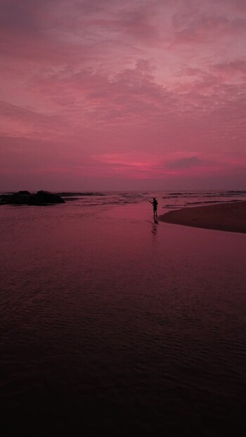 Aerial view of a fisherman on a beach at sunset Sri Lanka.