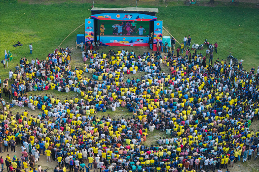 Dhaka Bangladesh 20 June 2026 Aerial view of Dhaka University Campus with a large crowd of football fans gathered on the grass to watch a match on a large outdoor screen. Dhaka Bangladesh 20 June 2026 Aerial view of Dhaka University Campus with a large crowd of football fans gathered on the grass to watch a match on a large outdoor screen.