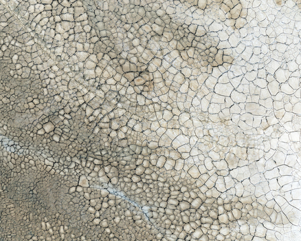 Aerial view of the intricate cracked earth patterns and dry soil textures at the Minas de Riotinto mining area Minas de Riotinto Andalusia Spain.