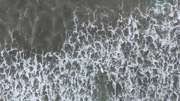 Aerial view of a surfer in the ocean Costa Rica. Aerial view of a surfer in the ocean Costa Rica.