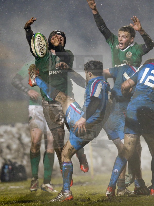 6 Feb 2015; Zack McCall intercepts the kick of Paolo Petrozzi . RBS 6 Nations U20 2015, Italy U20 v Ireland U20, Stadio Pozzo Lamarmora, Biella, Italy. Picture credit: Roberto Bregani / SPORTSFILE