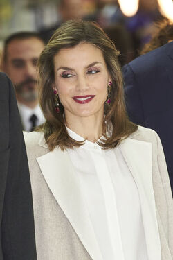 Queen Letizia of Spain fashions Uterq&uuml;e trousers a Hugo Boss shirt and Coollook earrings Madrid