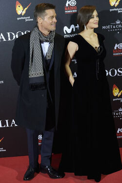 Pregnant Marion Cotillard leans in to speak to Brad Pitt as the pair promote their new film Allied in Madrid Spain