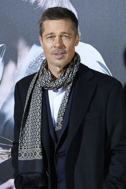 Pregnant Marion Cotillard leans in to speak to Brad Pitt as the pair promote their new film Allied in Madrid Spain