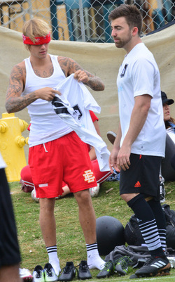 Justin Bieber playing football in a park in Playa Del Rey.
