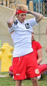 Justin Bieber playing football in a park in Playa Del Rey.