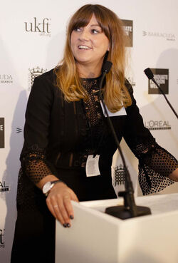 Alesha Dixon fashions a shiny turquoise jacket as she and boyfriend Azuka Ononye support Graduate Fashion Week London