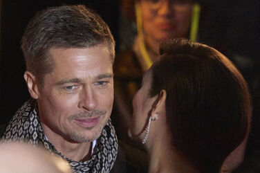 Pregnant Marion Cotillard leans in to speak to Brad Pitt as the pair promote their new film Allied in Madrid Spain