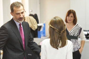 Queen Letizia of Spain fashions Uterq&uuml;e trousers a Hugo Boss shirt and Coollook earrings Madrid