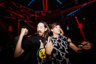 One Direction Member Louis Tomlinson shows off his tattoos as he is spotted at Hakkasan Nightclub
