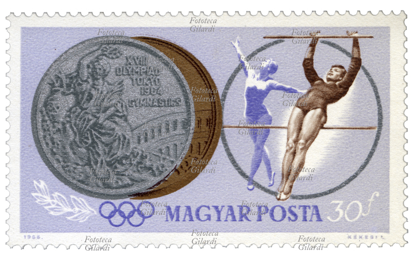 GINNASTICA FEMMINILE Francobollo della serie "Giochi olimpici estivi 1964 - Tokyo (II)" emessa dalle poste magiare per commemorare le vittorie degli atleti ungheresi nelle XVIII Olimpiadi di Tokyo del 1964. Nella vignetta la medaglia d\