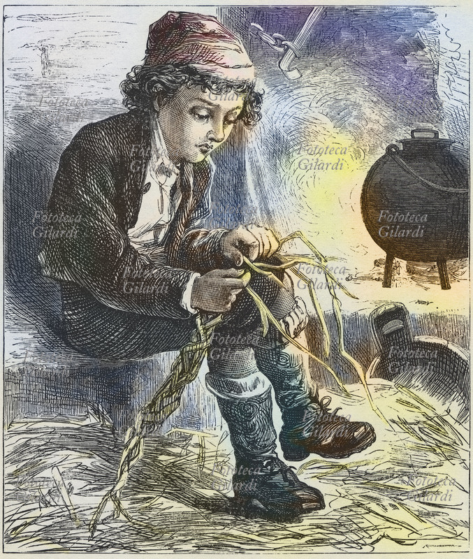 BAMBINI Bambino venditore ambulante si riscalda accanto al fuoco, acceso per cucinare il pranzo. Intanto intreccia la paglia che venderà poi di giorno. Stampa popolare, XIX secolo