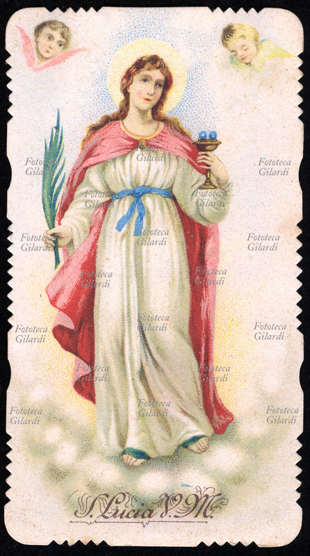 SANTA LUCIA (7 marzo 283 – 13 dicembre 304) Vergine e martire a Siracusa sotto Diocleziano. La Santa è raffigurata a figura intera, con in mano la palma del martirio e una coppa con gli occhi. Festa 13 dicembre. Immaginetta cromolitografica italiana, Milano 1912.