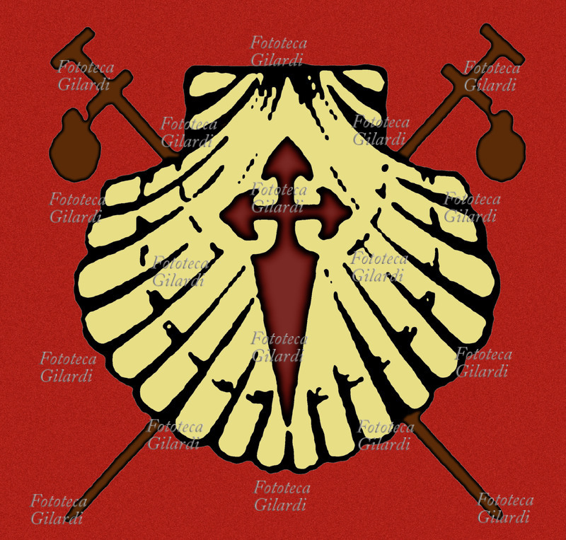 PELLEGRINAGGIO Tradizionale segno che dal medioevo caratterizzava i luoghi del Cammino di San Giacomo Maggiore, con i bastoni del viandante e la Croce sulla conchiglia, attualmente sostituito da una stilizzazione della sola conchiglia in giallo su blu. Luogo imprecisato, s.d.