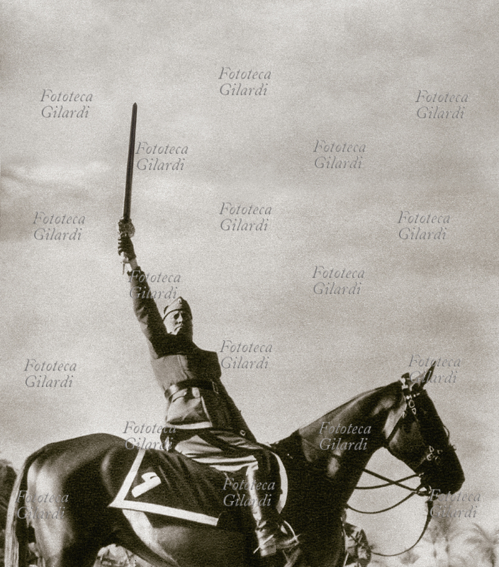 A.O.I WAR. 1936 Mussolini to horse exhibits the Islamic sword of founder of the Empire. Image from pamphlet of fascist propaganda of the age.