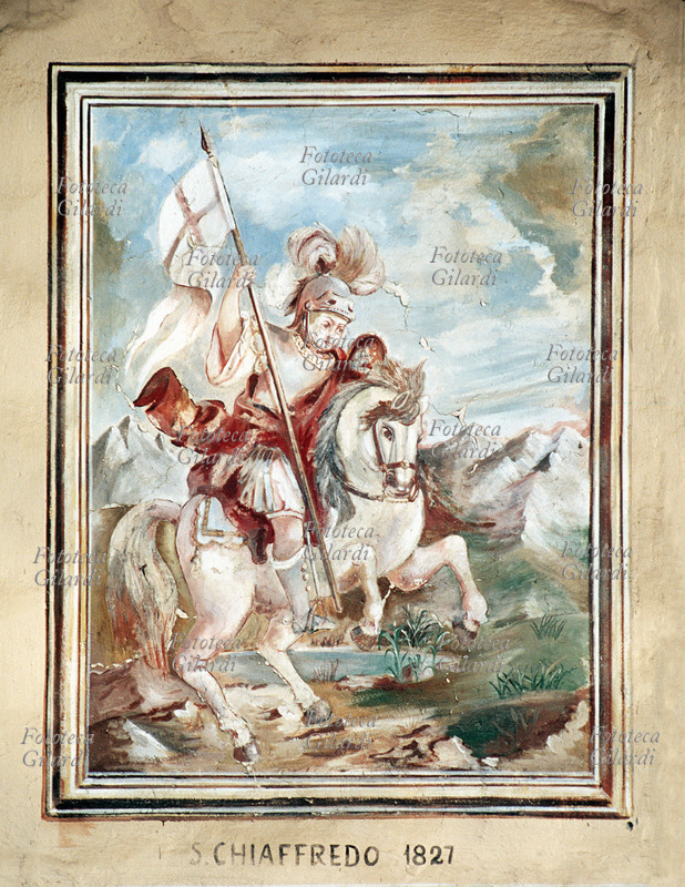 San CHIAFFREDO (III secolo), militare romano, tradizionalmente considerato un martire della Legione Tebea. Sfuggito alle decimazioni inflitte alla legione comandata da San Maurizio per essersi rifiutata di obbedire agli ordini di massacrare i cristiani del Vallese, ripiegò in Piemonte e lì subì il martirio. Affresco, Sampeyre (Cuneo), frazione Calchesio, 1827. Fotografia di Elena Piccini, Italia 2002.