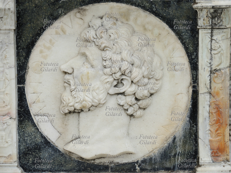 "ANTONINUS MAGNUS CONSUL", decoration in bas-relief from the band depicting famous characters of antiquity and mythological themes, inspired by the medals of the Roman era, carved on the base of the facade of the basilica of the Certosa di Pavia, a typical example of Lombard Renaissance architecture of the fifteenth century.