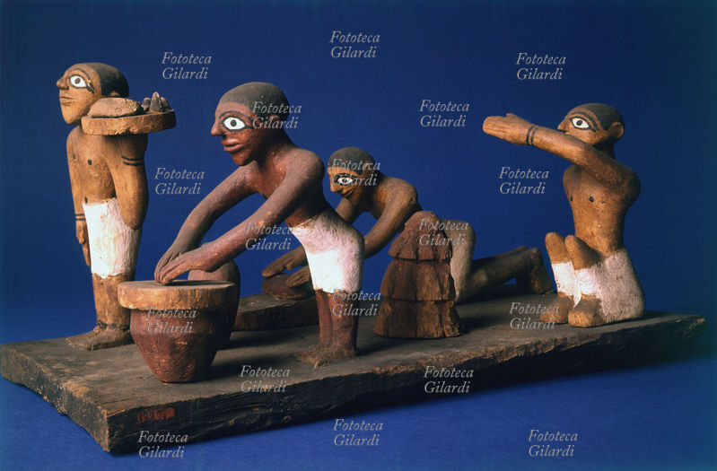 ANTICO EGITTO terracotta raffigurante la preparazione di cibo accompagnato da preghiere.