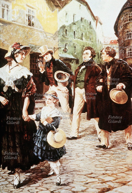 Franz SCHUBERT (1797-1828), al centro con gli amici L. Kupelwieser e F. von Schober a passeggio in una strada viennese. Litografia di Otto Nowak (1874-1945).