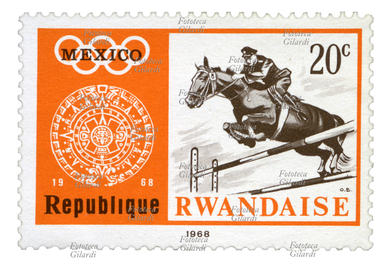 HORSE RIDING Stamp from the series "Summer Olympic Games 1968 - Mexico City (II)" issued by the Rwandan post office. In the cartoon the Piedra del Sol and a knight engaged in the jump. Drawing by the Belgian painter Oscar Bonnevalle (1920 - 1993), face value 20 santime, offset. Republic of Rwanda, issued October 24, 1968