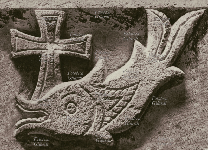CHRISTIANITY the Christian symbols of the cross and the fish in a coming relief from Erment, in Egypt, of III sec. d.C. Paris, Louvre