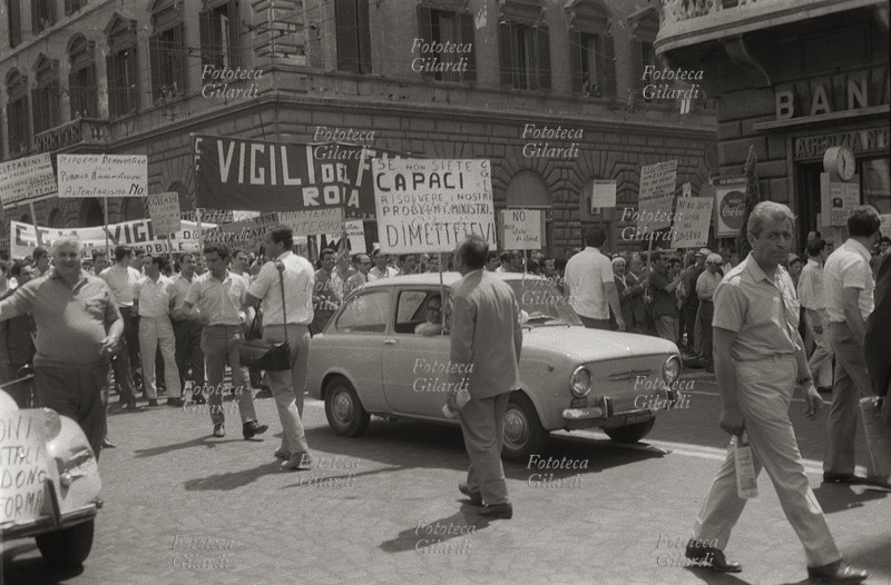 STRIKE of state workers: the procession in via Nazionale. Demonstrators march with protest signs: \