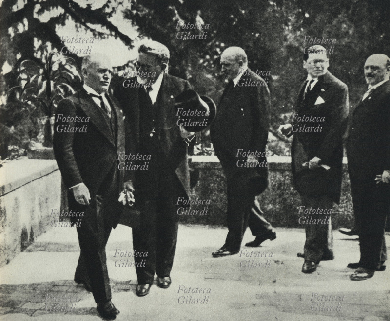 FASCISM Benito Mussolini (29 July 1883 – 28 April 1945) visits the Italian Institute of Germanic Studies at Villa Sciarra-Wurts on the Gianicolo. With him, Senator Giovanni Gentile (29 May 1875 – 15 April 1944). Rome, November 1931.