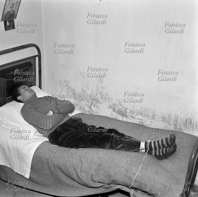ALBANO DI LUCANIA Young man (Rocco Abate), lying and tied on the bed, mimes some experiences of \