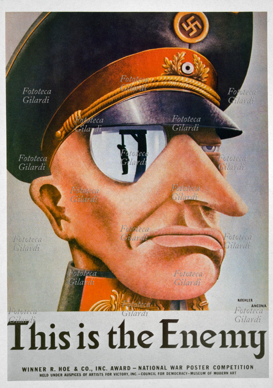 II GM NAZISMO Questo è il Nemico. La sagoma di un impiccato sulla forca si riflette nel monocolo di uno sprezzante ufficiale nazista. Poster di guerra vincitore del Premio R. Hoe & Co. Inc., concorso nazionale promosso dall\
